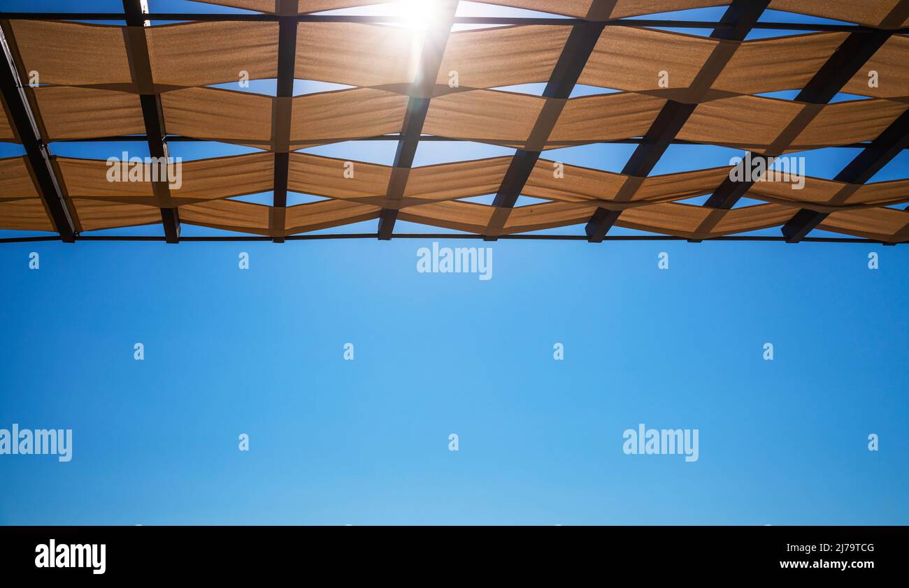 View of the wicker roof in sunlight from below Stock Photo