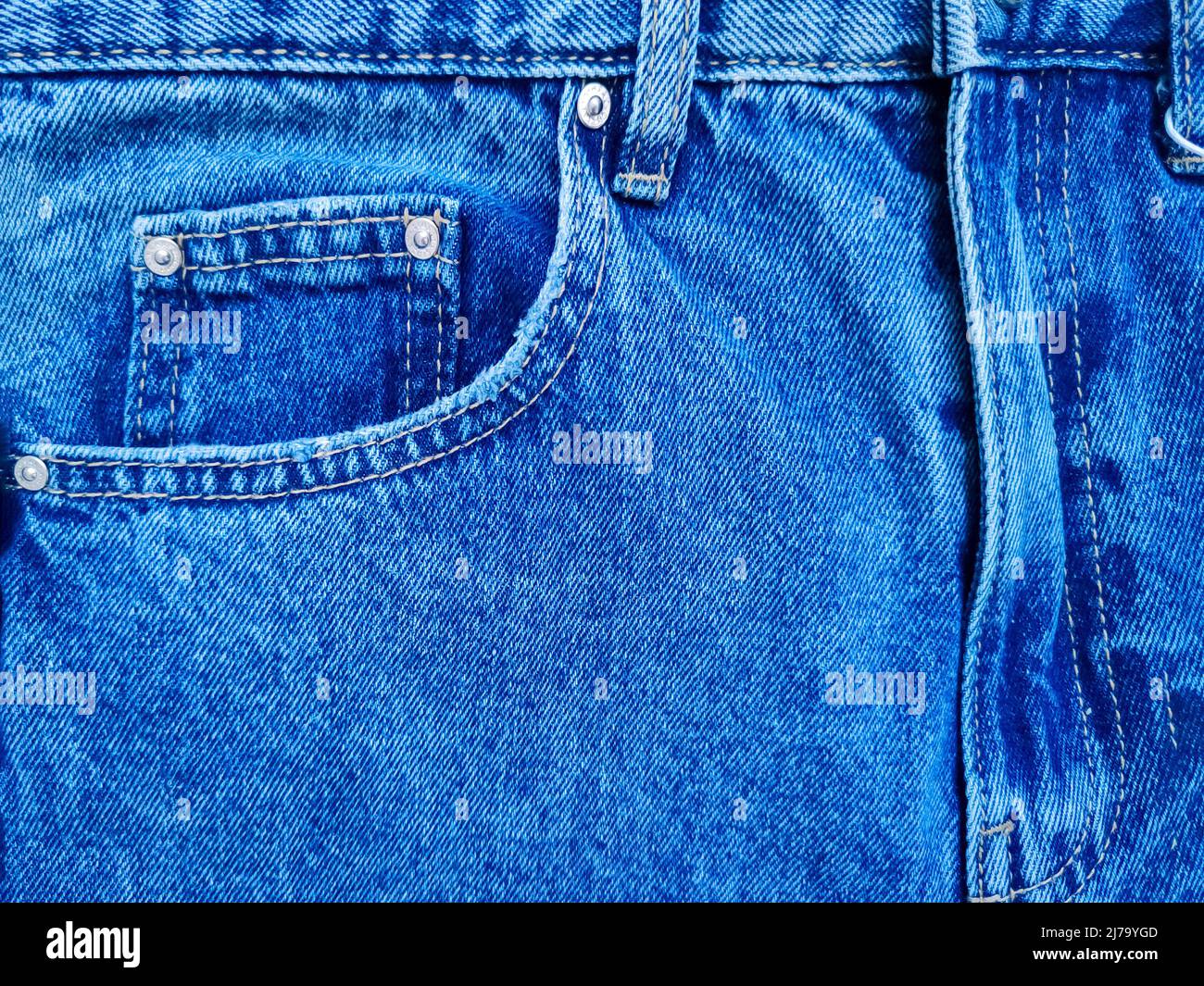 Blue denim Jeans pocket with revits texture background Stock Photo
