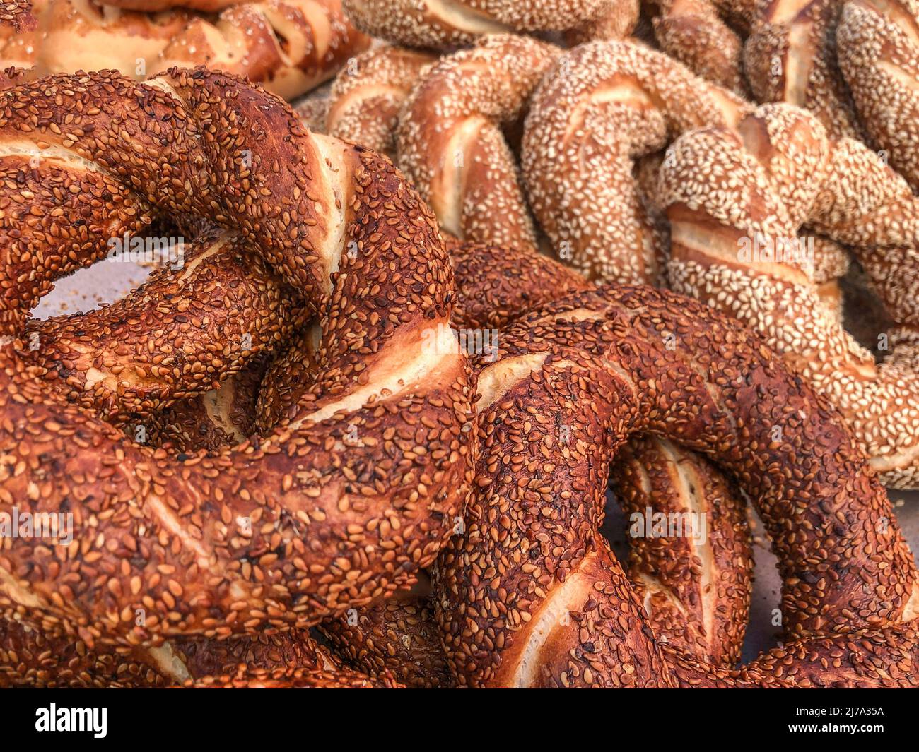 pile of delicious turkish bagels as a background. traditional fast food known as simit in Turkey Stock Photo