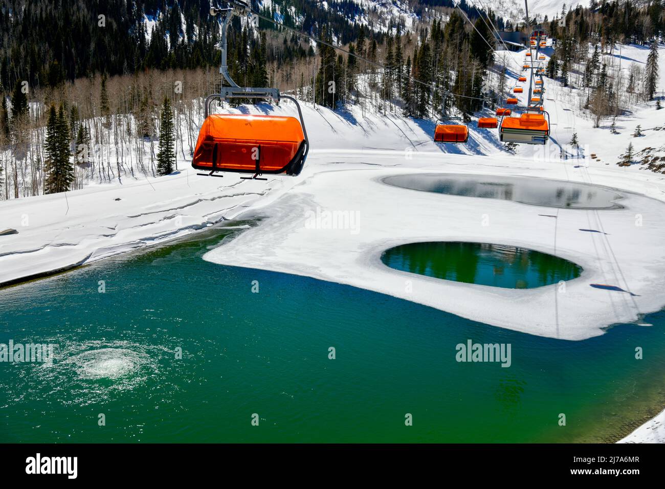 Orange bubble chair lift at Park City Canyons Ski Area in Utah. Late