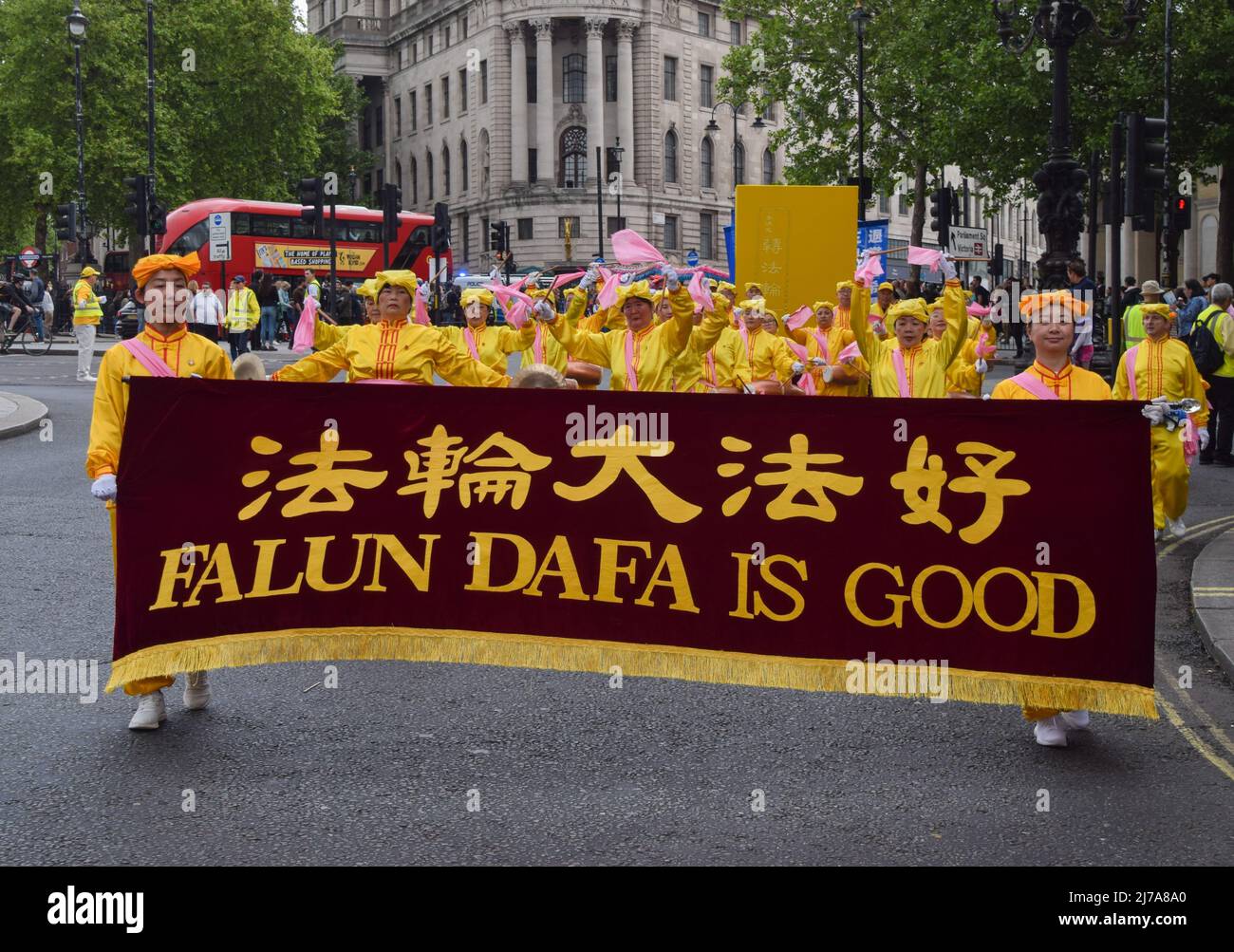 London, UK. 7th May 2022. Practitioners in Trafalgar Square. Falun Dafa (also known as Falun Gong) practitioners marched through central London to Downing Street on the 30th anniversary of the founding of the movement, to celebrate the practice and to raise awareness of the persecution faced by the practitioners in China. Falun Gong combines meditation and Qigong exercises with moral philosophy, and has been subjected to an ongoing crackdown by the Chinese Communist Party. Credit: Vuk Valcic/Alamy Live News Stock Photo