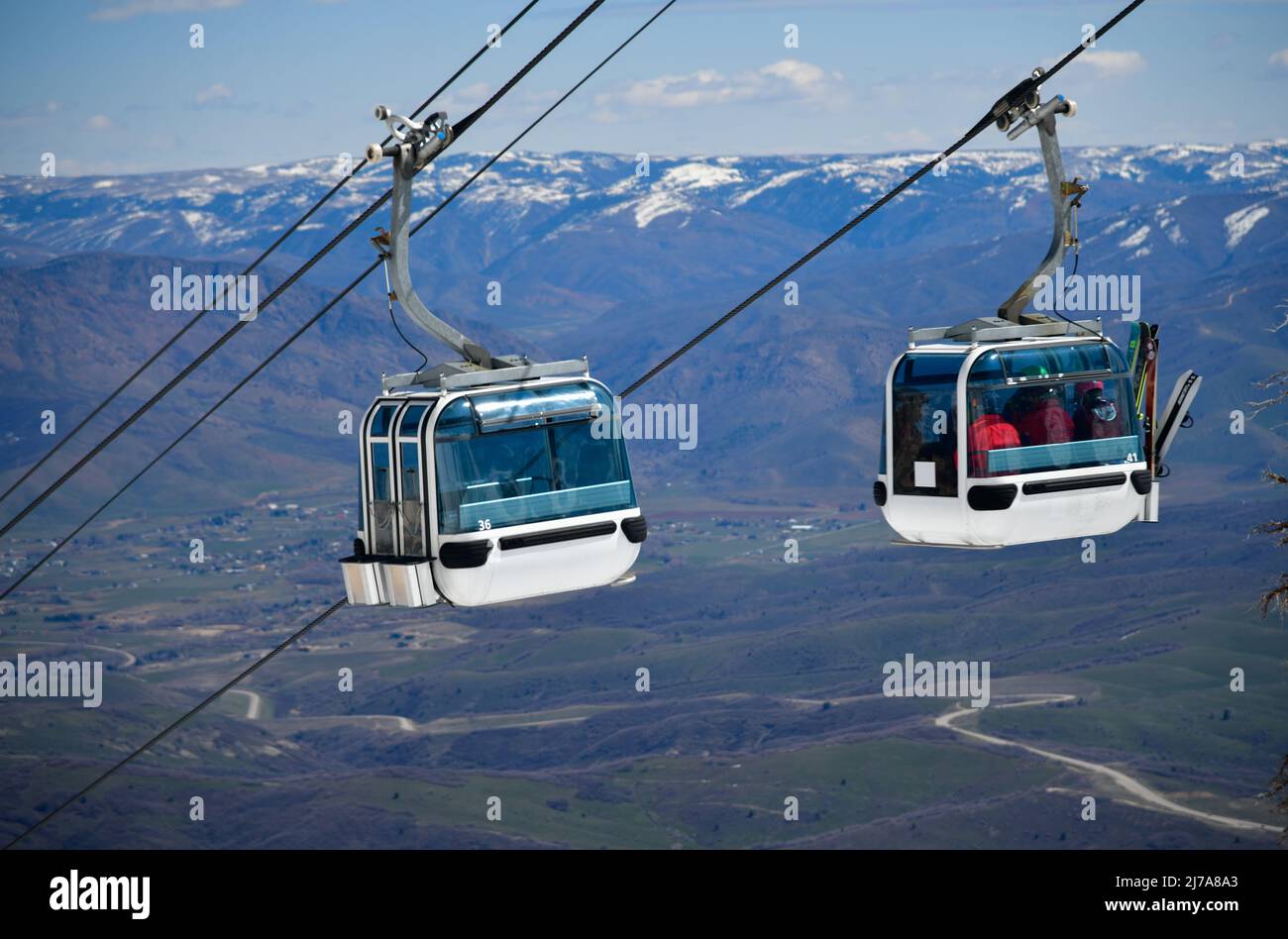 Gondola lift going up at the Snowbasin Ski Resort in Utah. Breathtaking view to the valley. Stock Photo