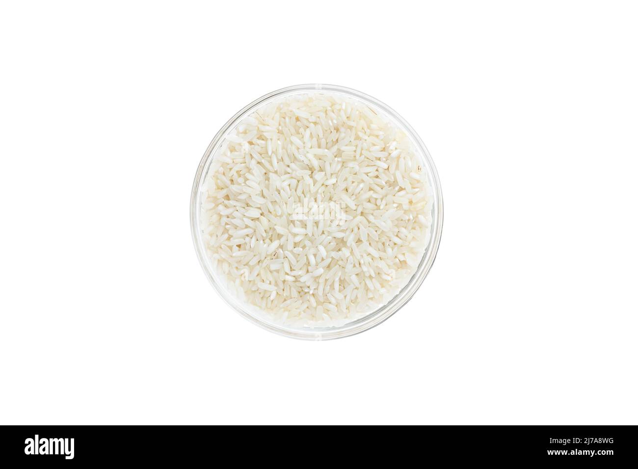 Rice groats in a glass bowl isolated on white background, top view. Healthy food Stock Photo