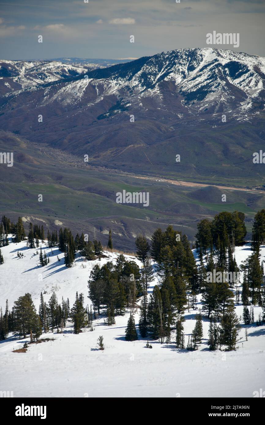 Beautiful landscape at Snowbasin Ski Resort, Utah. Range of mountains with peaks covered with snow. Stock Photo
