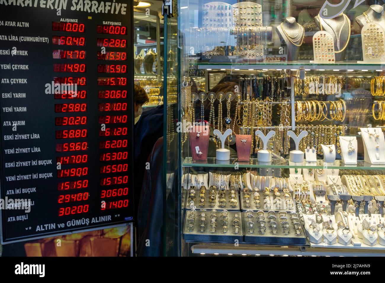 May 7, 2022: People walk past a currency exchange office and jewelery shop  in one of the central district of Kadikoy on May 07, 2022 in Istanbul,  Turkey. Inflation soared to nearly