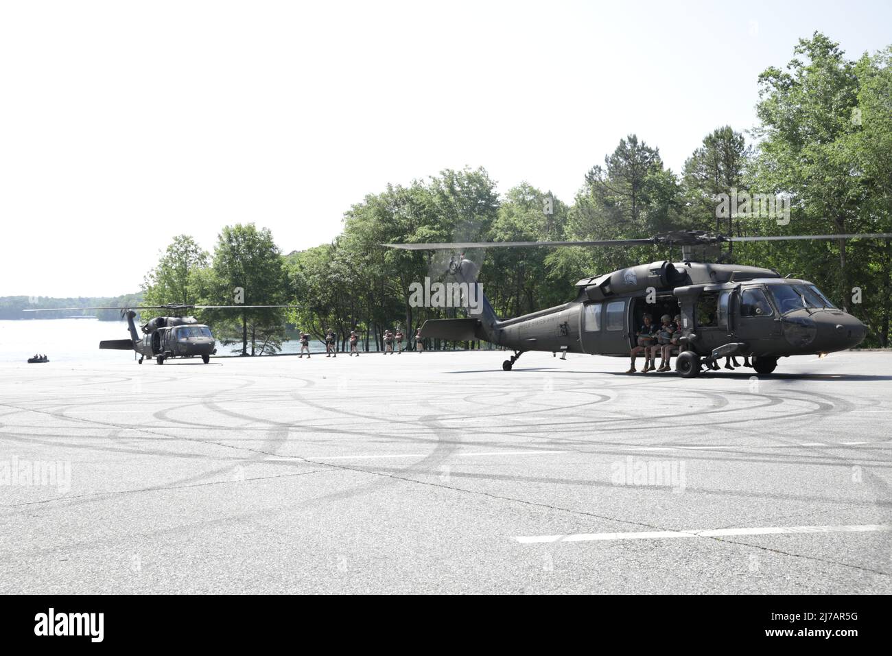 A group of U.S Army Rangers, assigned to the 5th Ranger Training Battalion, in an UH-60 aircraft prepares to conduct a water jump into Lake Lanier at War Hill Park, Dawnsonville, Ga., May 5, 2022. The annual training event, hosted by the 5th Ranger Training Battalion, gives Rangers an opportunity to become proficient in water landings, while giving the local community a chance to see the Rangers train in the Lake Lanier area. (U.S. Army Reserve photo by Sgt. Kelson Brooks) Stock Photo