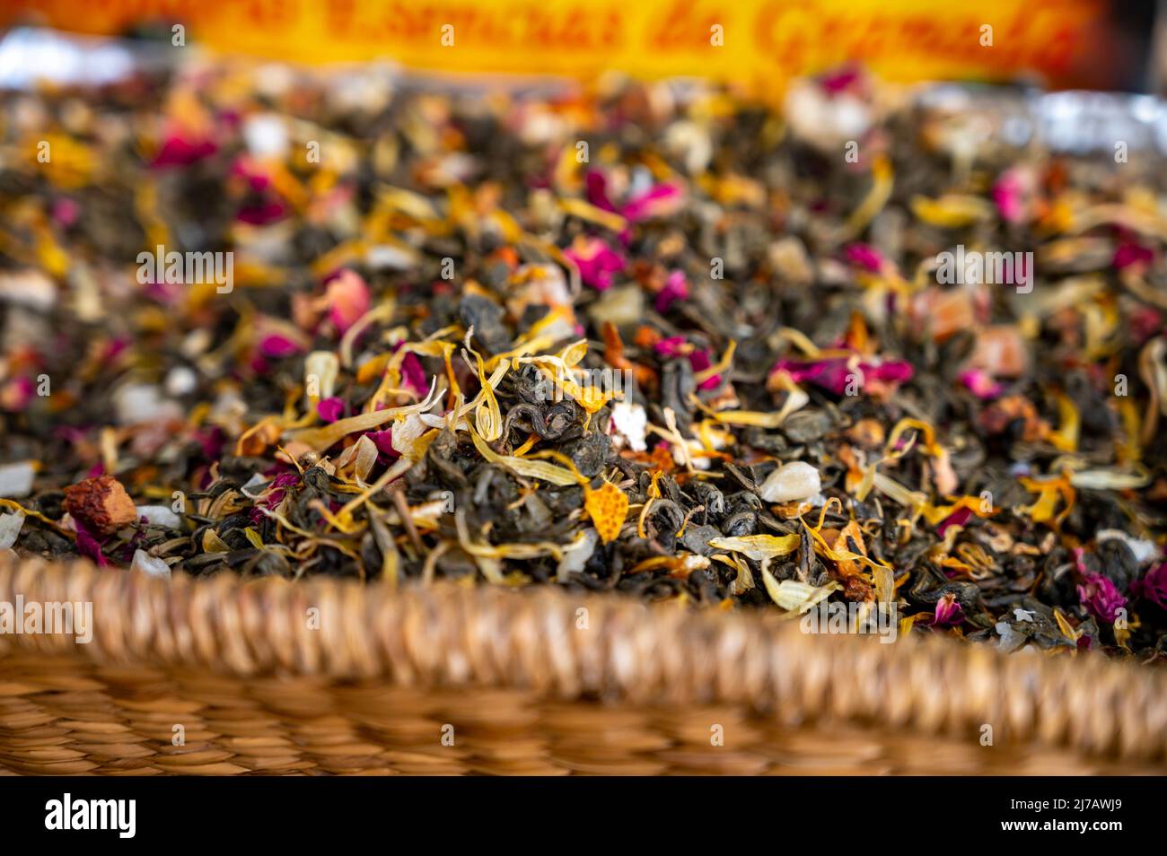 Blended black leaf dry tea with aromatic flowers, spices in tea shop in ...