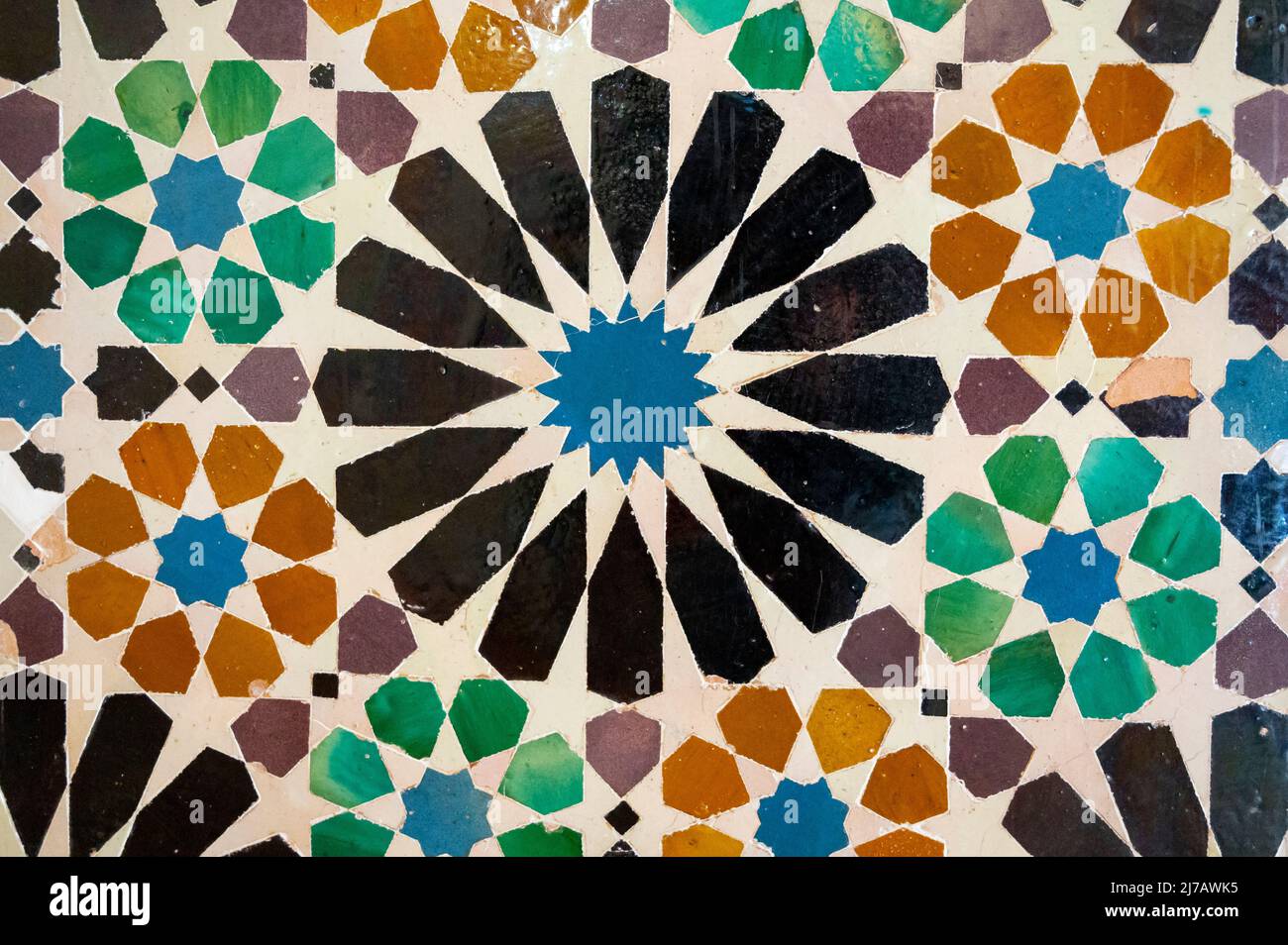 Ornamental medieval ceramic tiles of walls in Nasrid Palaces in the