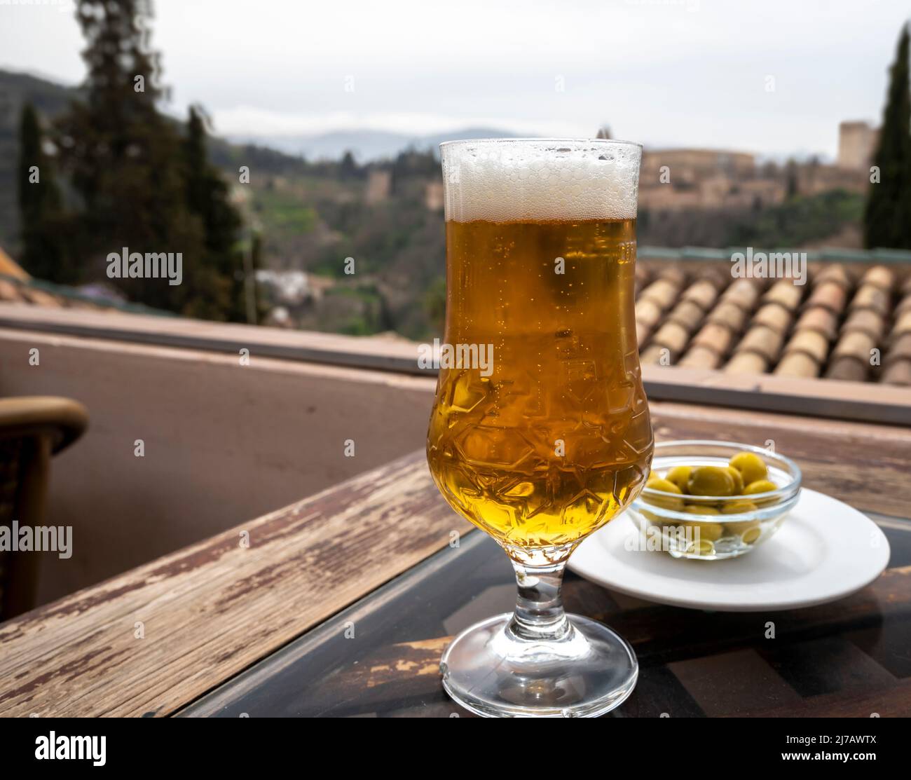 Spanish Beer And Glass Bowl With Green Andalusian Olives Served On Spanish Beer And Glass Bowl With Green Andalusian Olives Served On