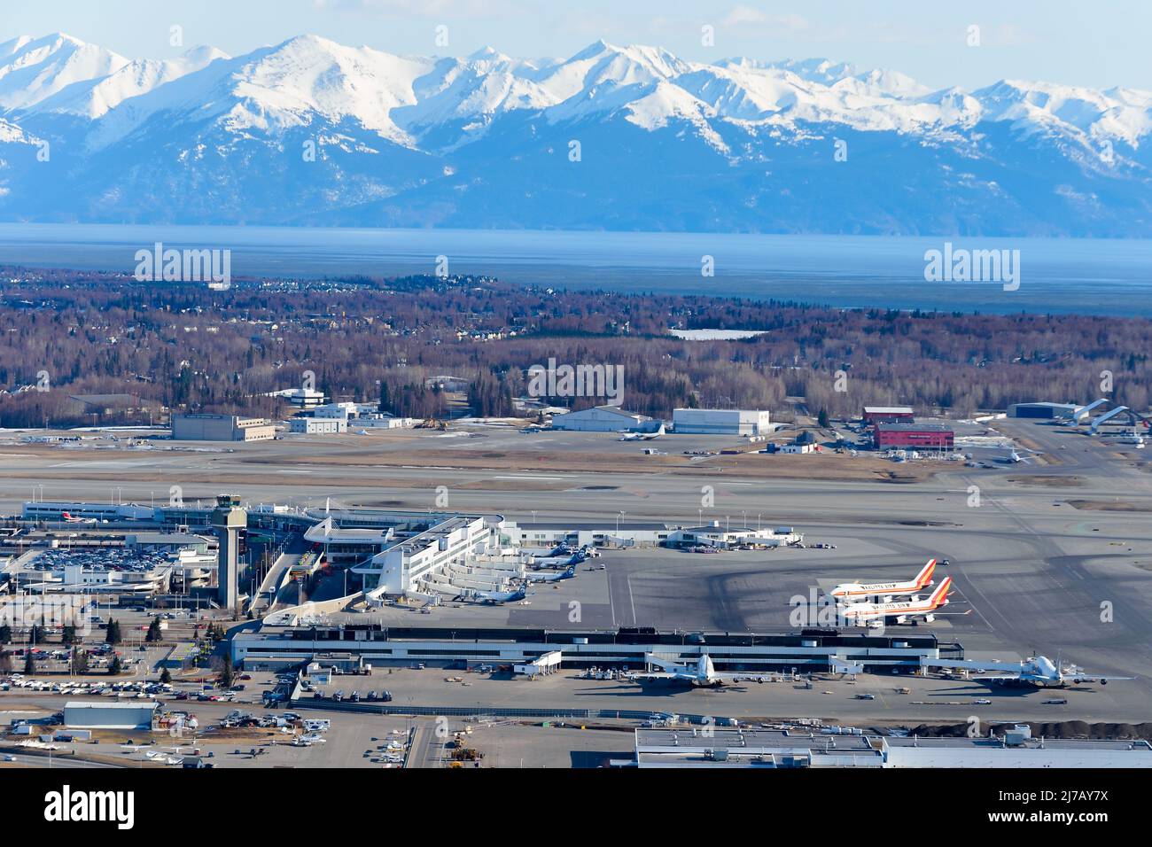 Anchorage Airport terminal aerial view in Alaska with mountain behind
