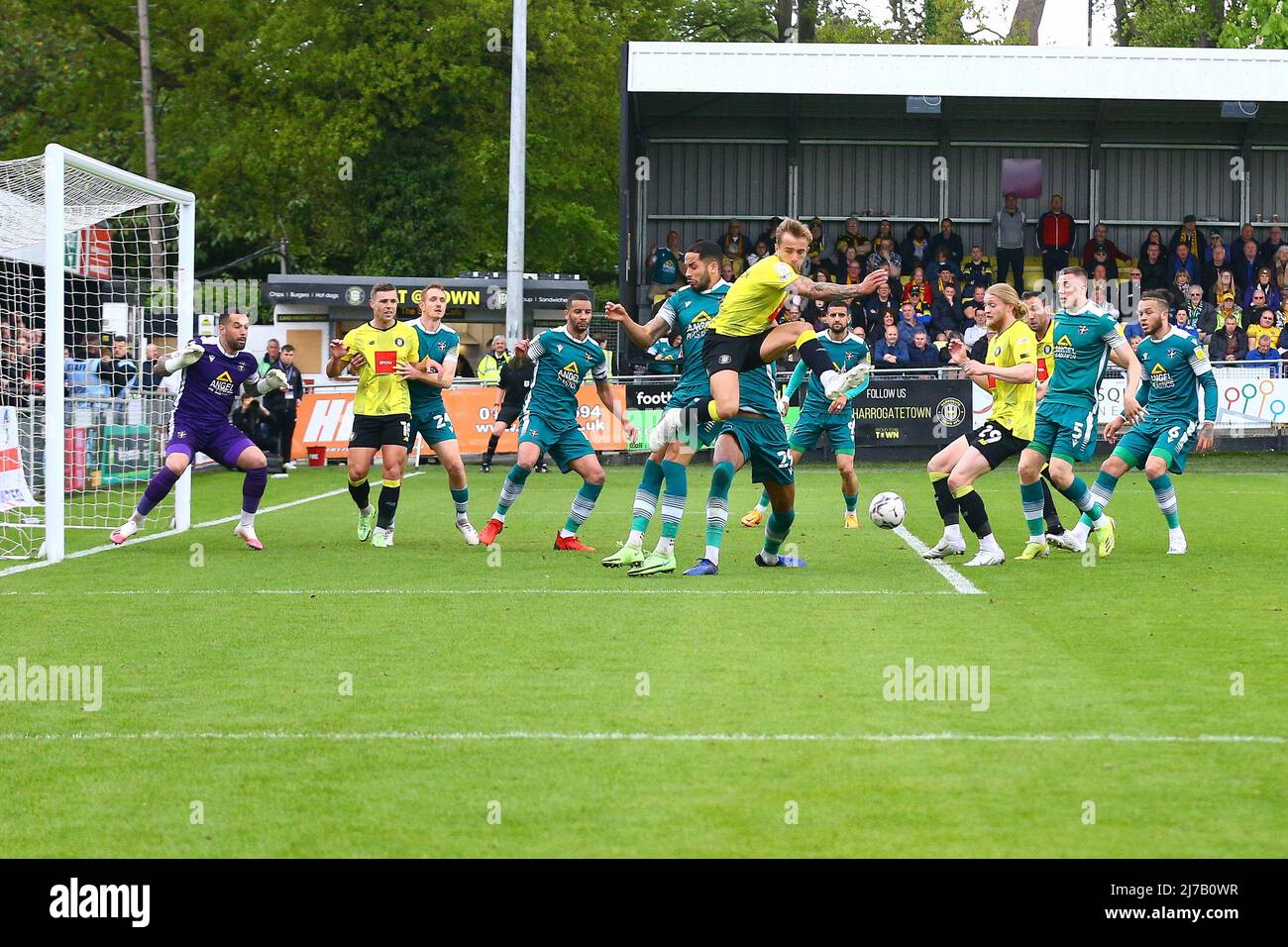 The EnviroVent Stadium, Harrogate, England - 7th May 2022 Alex Pattison (16) of Harrogate gets to the ball before Kylian Kouassi (27) of Sutton United - during the game Harrogate v Sutton, EFL League 2, 2021/22, at The EnviroVent Stadium, Harrogate, England - 7th May 2022  Credit: Arthur Haigh/WhiteRosePhotos/Alamy Live News Stock Photo