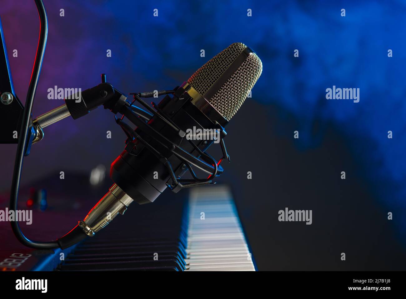 Professional microphone and midi keyboard, synthesizer. Neon blue