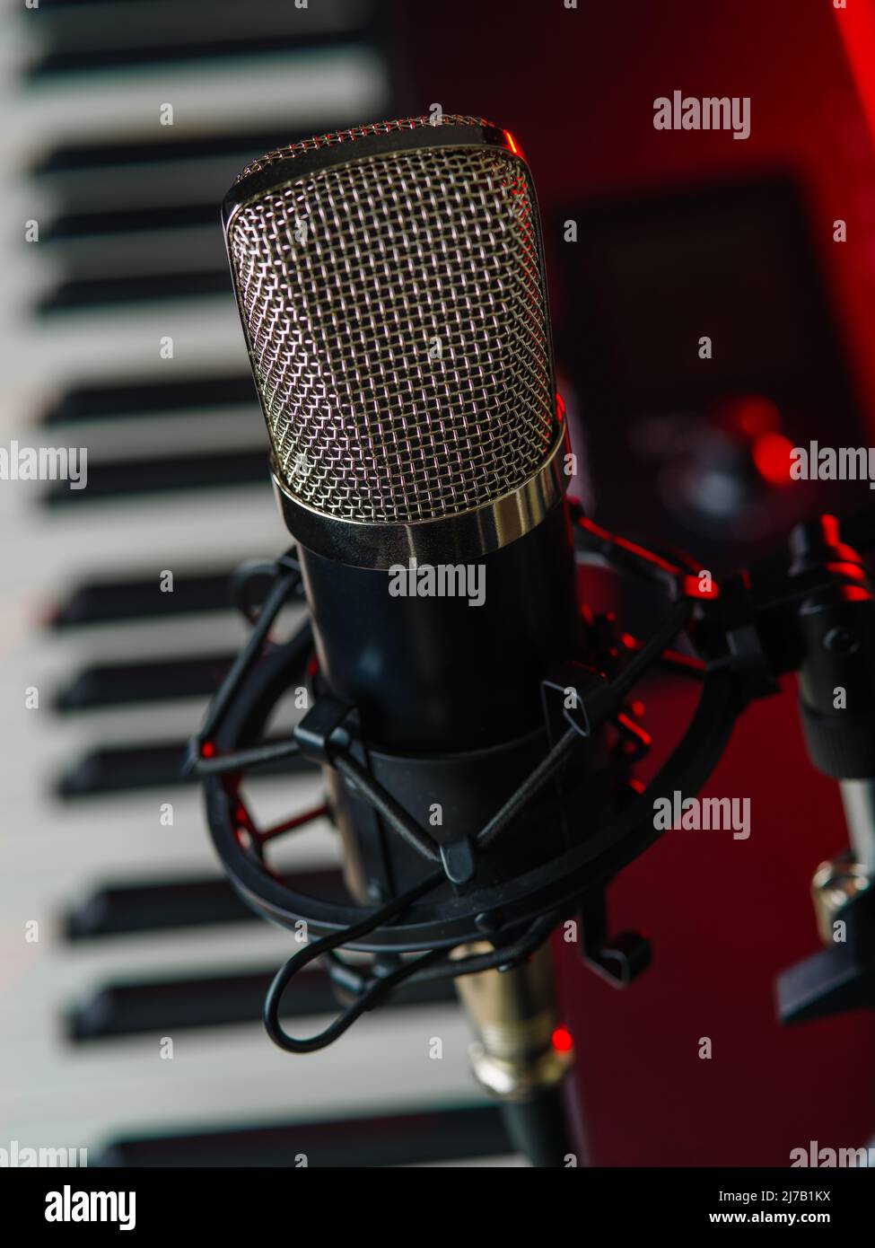 Macro shot. Professional microphone and midi keyboard. Singing, music