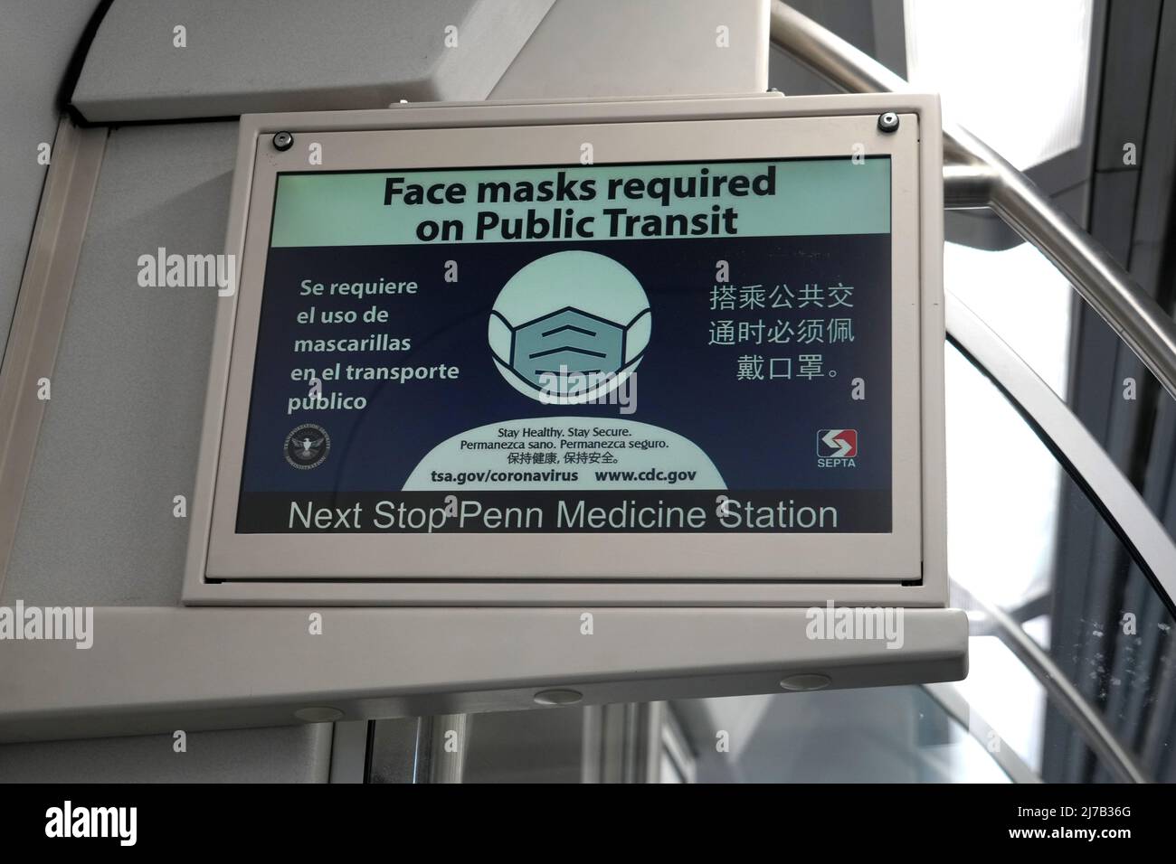 A Face Masks required sign in English and Spanish on a Southeastern