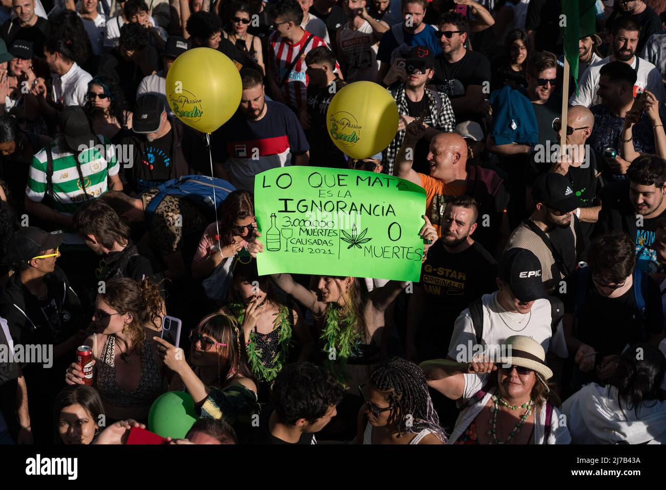 Protesters hold anti-alcohol and pro-cannabis placard during the demonstration. Thousands of pro-cannabis activists took part in a demonstration in La Gran Via in Madrid, Spain, in favor of legalizing the medicinal and recreational use of marijuana. (Photo by Diego Radames / SOPA Images/Sipa USA) Stock Photo