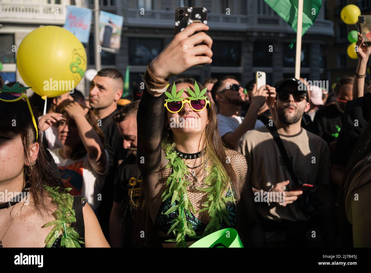 Pro-cannabis protesters in marijuana suits seen during the demonstration. Thousands of pro-cannabis activists took part in a demonstration in La Gran Via in Madrid, Spain, in favor of legalizing the medicinal and recreational use of marijuana. (Photo by Diego Radames / SOPA Images/Sipa USA) Stock Photo