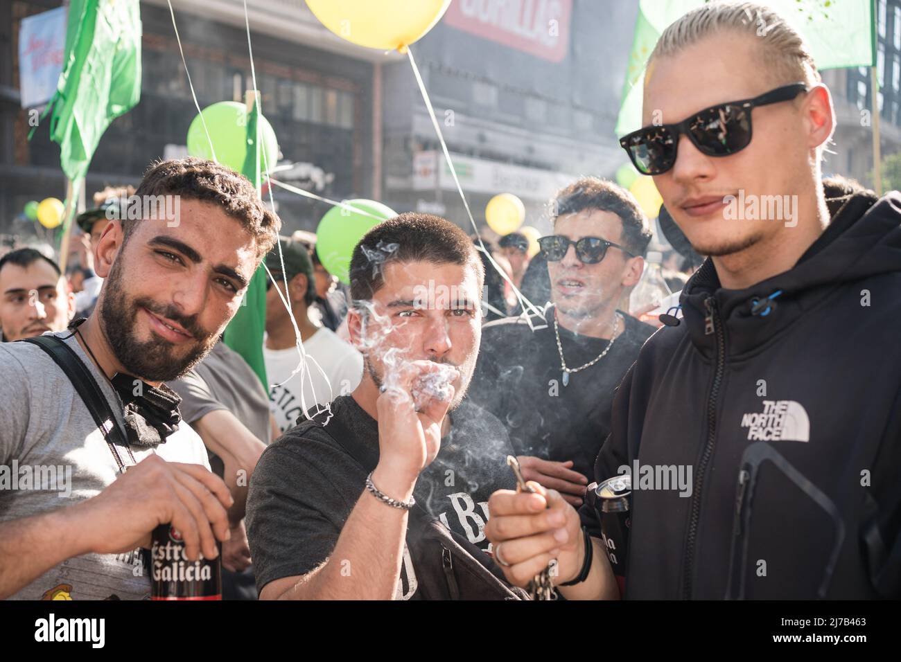 A pro-cannabis protester smokes a joint during a demonstration. Thousands of pro-cannabis activists took part in a demonstration in La Gran Via in Madrid, Spain, in favor of legalizing the medicinal and recreational use of marijuana. (Photo by Diego Radames / SOPA Images/Sipa USA) Stock Photo