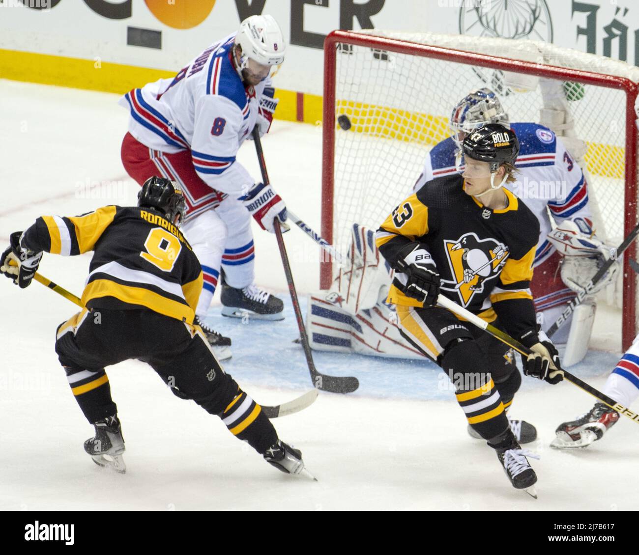Pittsburgh, United States. 07th May, 2022. New York Rangers right wing Kaapo  Kakko (24) scores over a diving Pittsburgh Penguins defenseman Marcus  Pettersson (28) in the first period during the first round