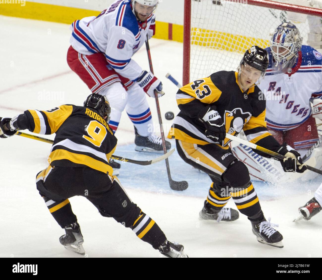 Pittsburgh, United States. 07th May, 2022. New York Rangers right wing Kaapo  Kakko (24) scores over a diving Pittsburgh Penguins defenseman Marcus  Pettersson (28) in the first period during the first round