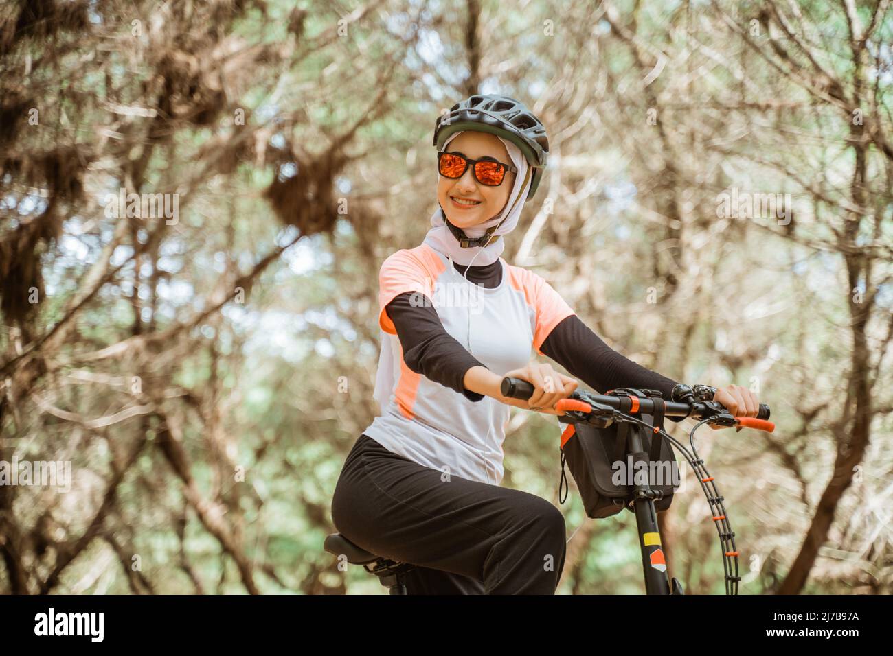 sunglasses smiling while riding bicycle 
