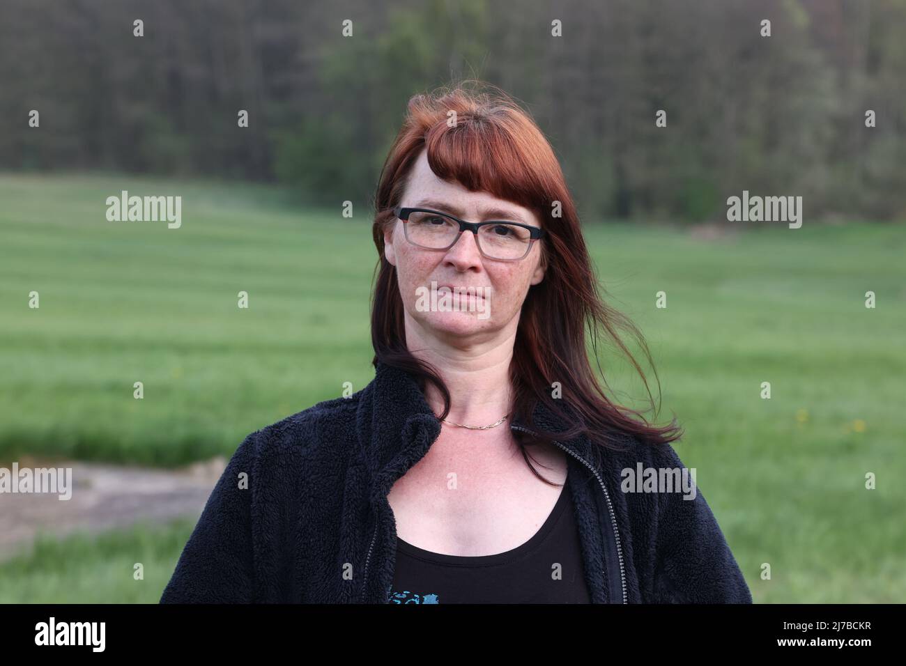 05 May 2022, Saxony, Schöneck: Corinna Heinrich stands in a meadow. Young deer are in mortal danger during the first mowing. Conservationists offer help - and Saxony has also upgraded its technology, because farmers face prosecution. (to dpa: 'Volunteers for fewer dead fawns during mowing') Photo: Bodo Schackow/dpa Stock Photo