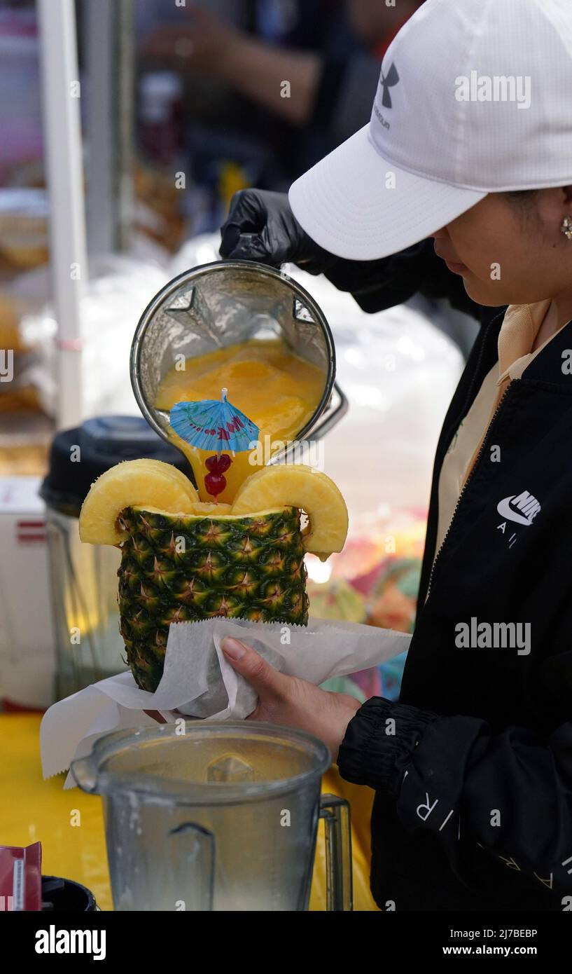 St. Louis, United States. 08th May, 2022. A Pina Colada is poured into a pineapple at the Cinco de Mayo celebration in St. Louis on Saturday, May 7, 2022. Photo by Bill Greenblatt/UPI Credit: UPI/Alamy Live News Stock Photo