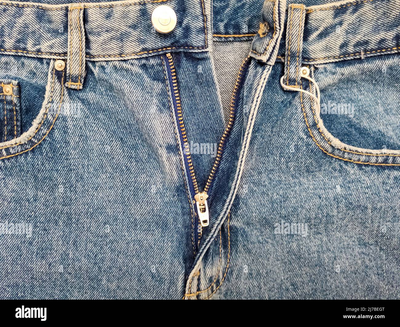 Zipper on jeans. Jeans texture. Close-up denim background. Unzipped ...