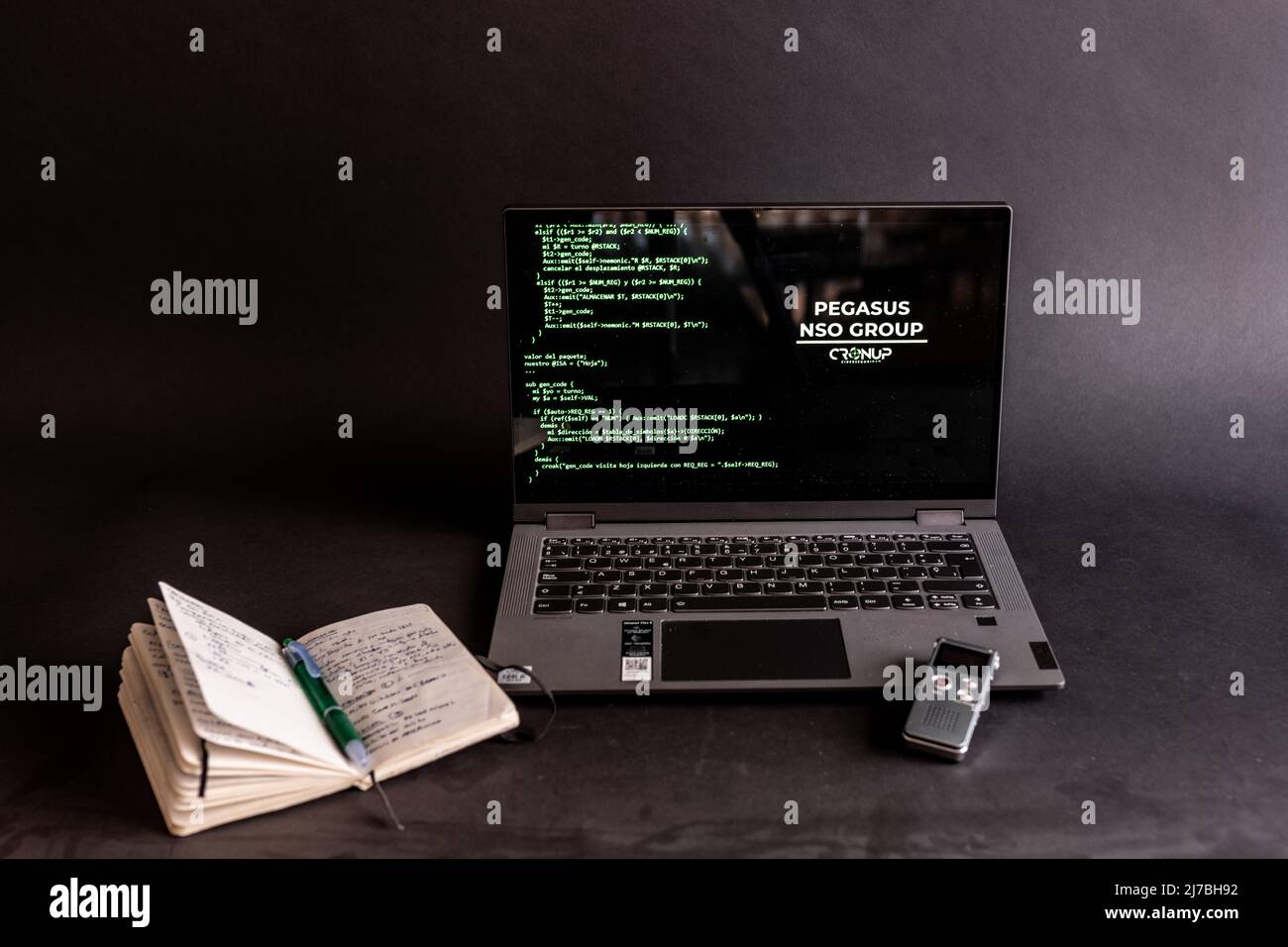 Concept of hacking and malware. Hacker using an abstract laptop with a binary code digital interface. Young hacker in cybersecurity concept. Stock Photo