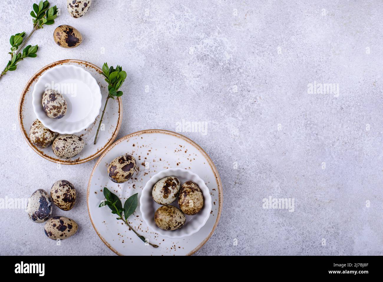 Bowl with quail eggs on light background Stock Photo