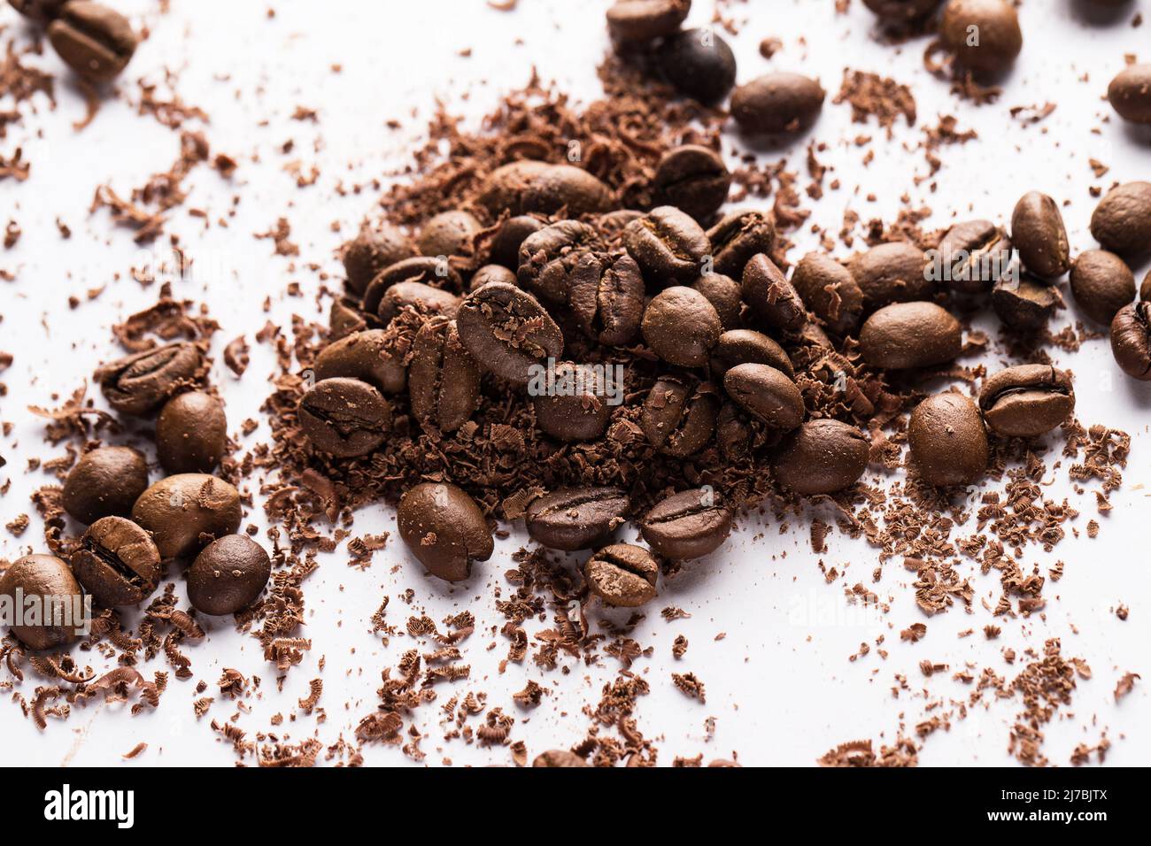 Coffee beans and particles of black chocolate Stock Photo Alamy