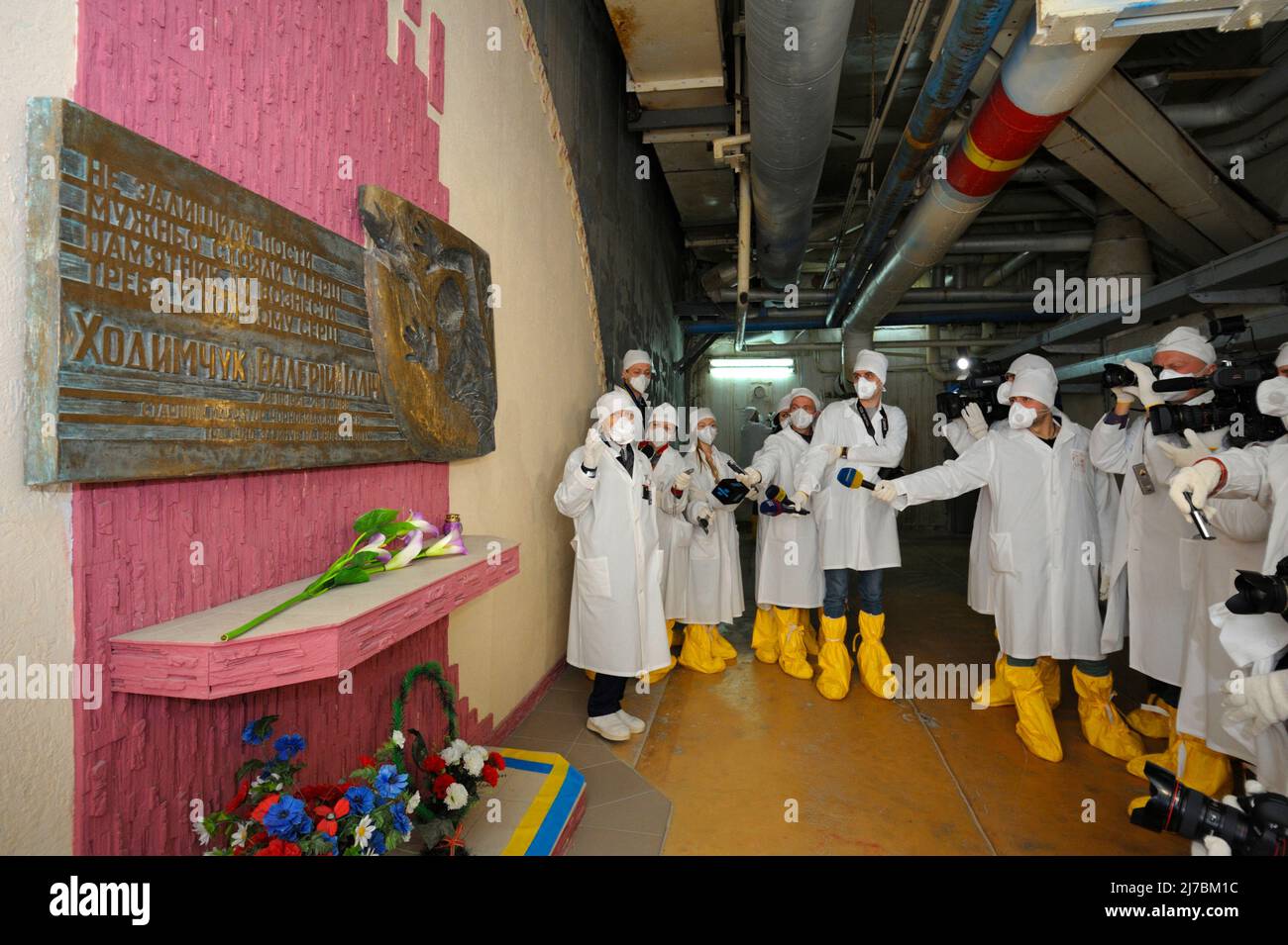 Journalists standing near monument to Chernobyl Liquidators situated inside  of building of Chernobyl Nuclear Power Plant. Press-tour to ChNPP for mass  Stock Photo - Alamy
