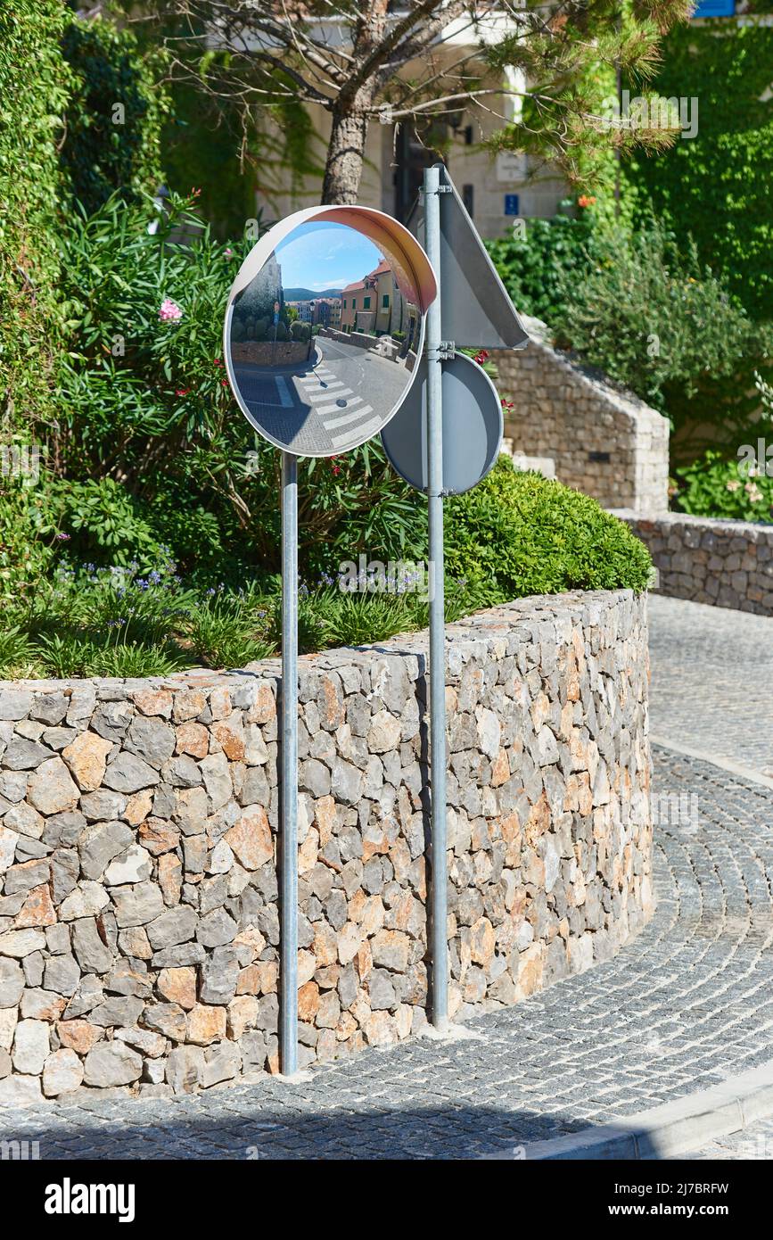 Road mirror for safe driving in the city Stock Photo