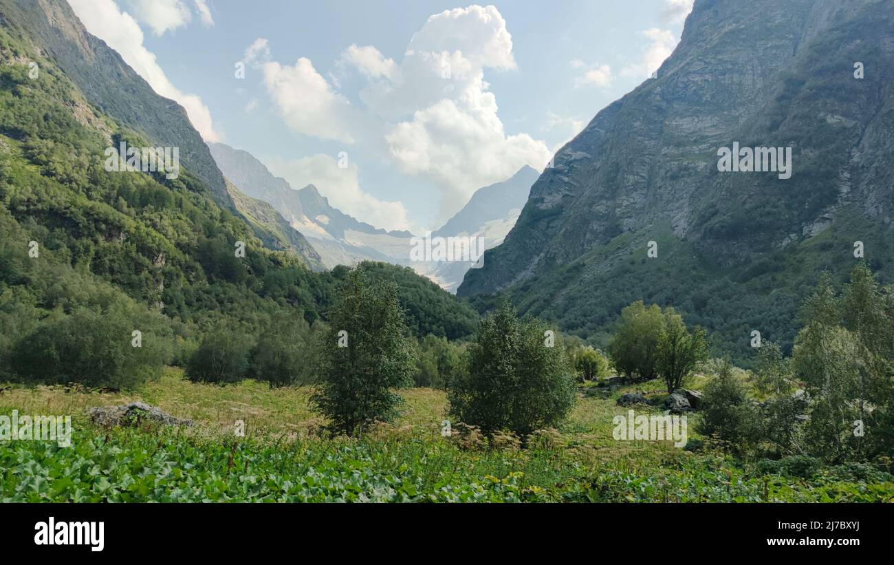 Summer View of Dombay Mountains and valley travel in Russia Stock Photo