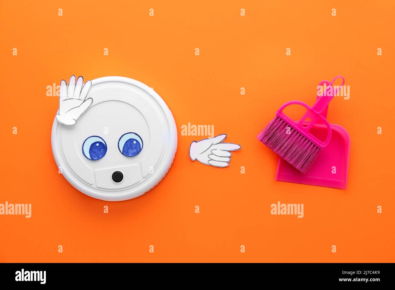 Modern robot vacuum cleaner with drawn eyes, broom and dustpan on color