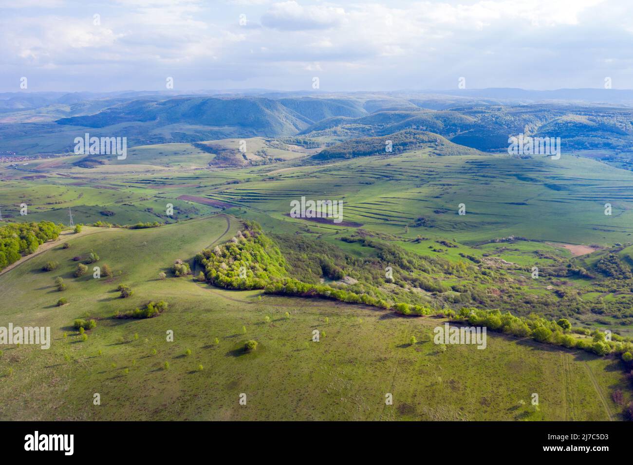 Aerial view of a green wild pasture, countryside range in the spring Stock Photo