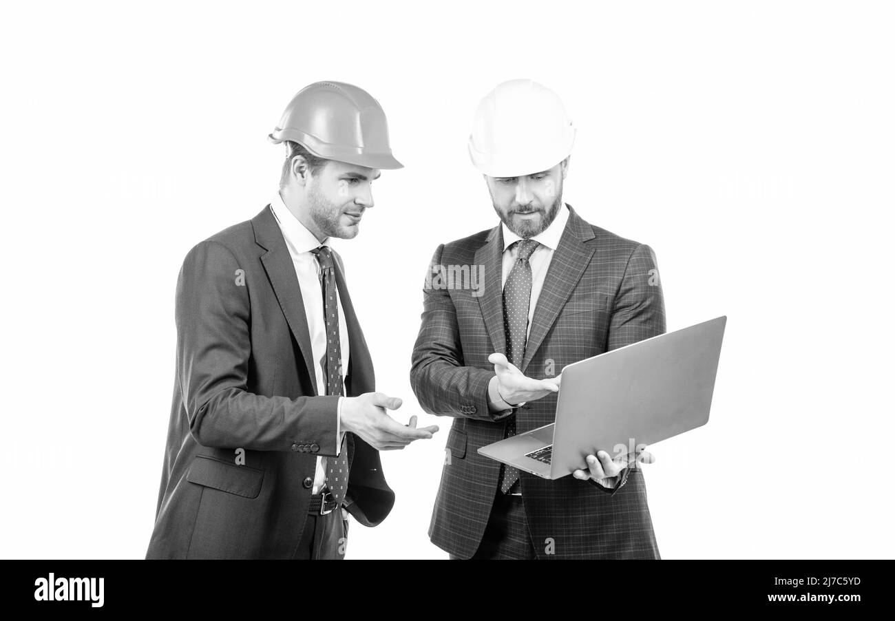 architects planning work. chief engineer and executive in hardhat use computer. Stock Photo