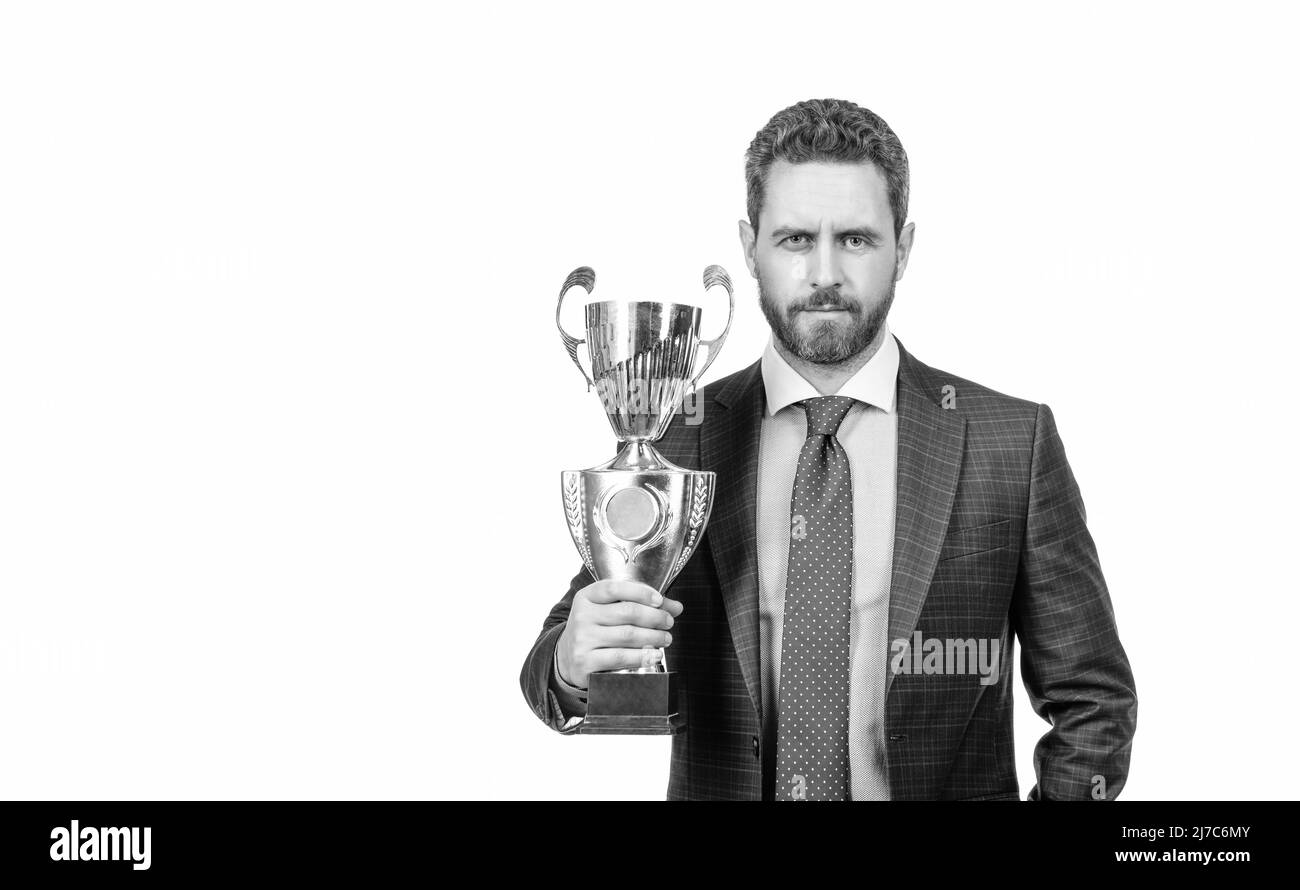 achievement. copy space. mature businessman in suit hold golden cup. business success. Stock Photo