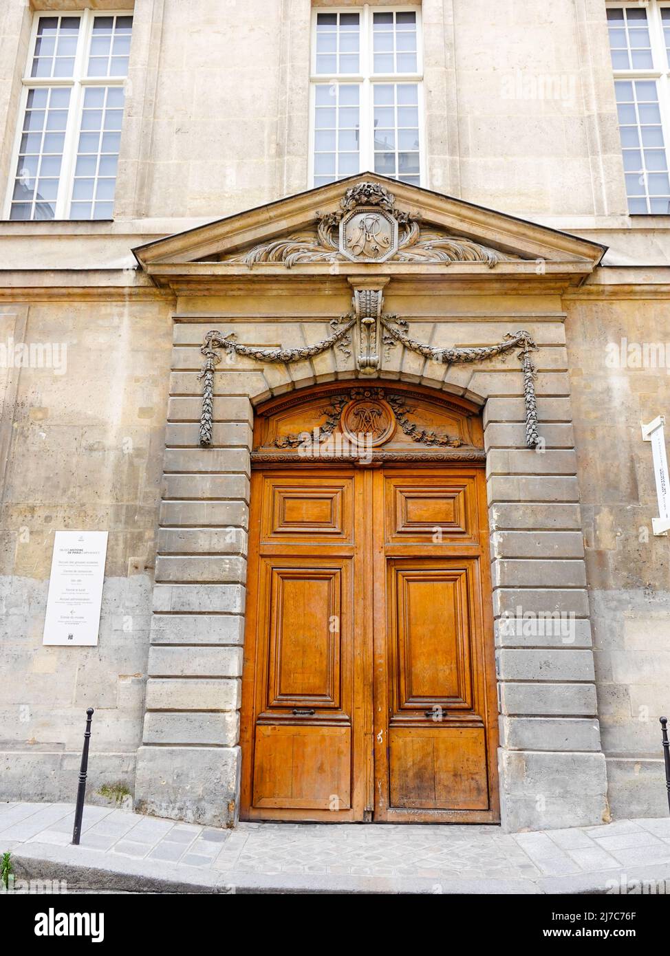 Large double doors on the side of the Museum of the History of Paris, Carvavalet, building, Paris, France. Stock Photo