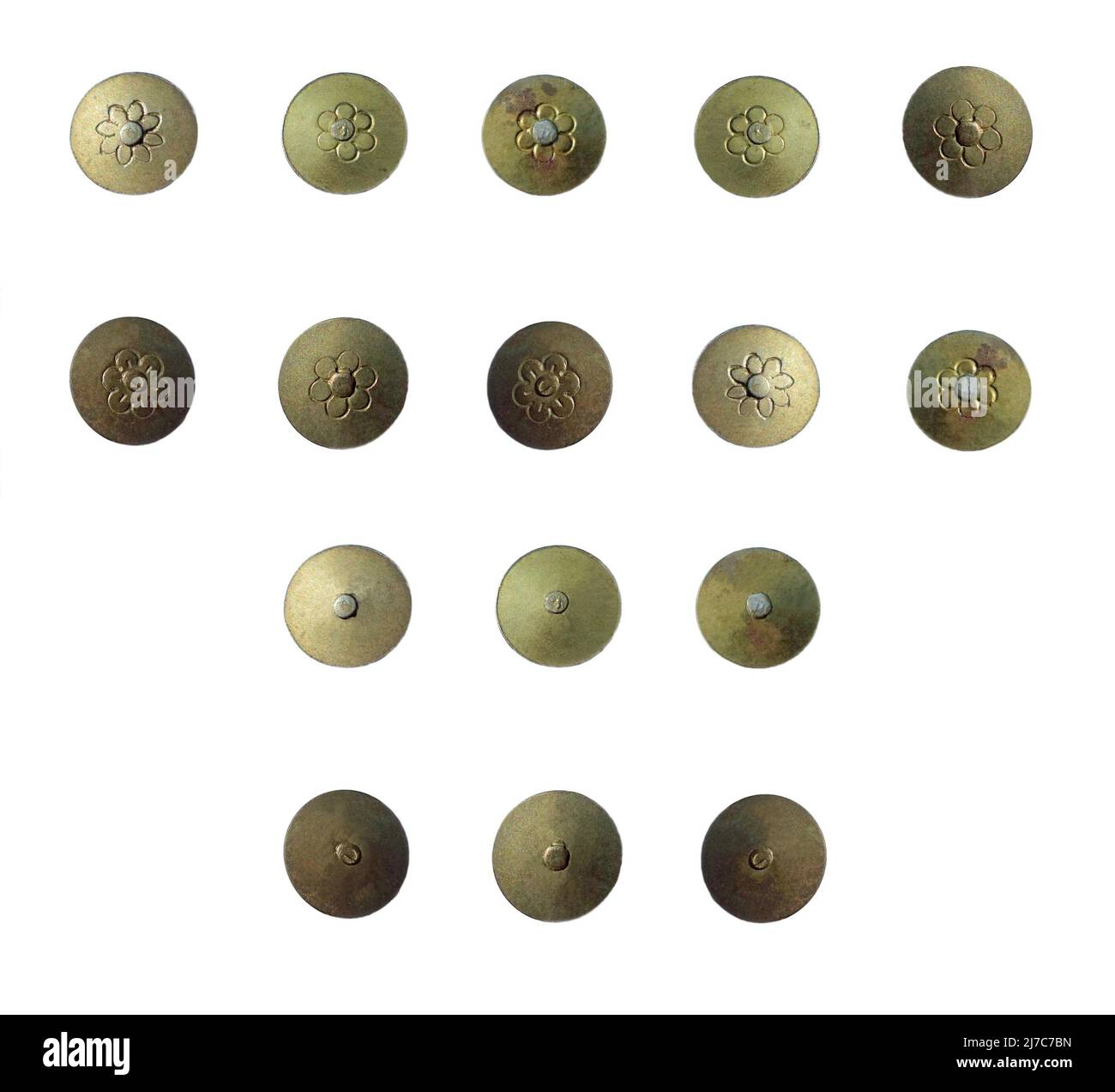 Old, retro or vintage metal drawing pins – push pins or thumb tacks – ‘pinned’ to a white background. These fixings have brass heads and an aged patina. They are suitable for using with other graphic material, for instance, used (small) in the corners of sheets of old paper and printed ephemera to give the effect of being attached and displayed on a wall or notice board. Stock Photo