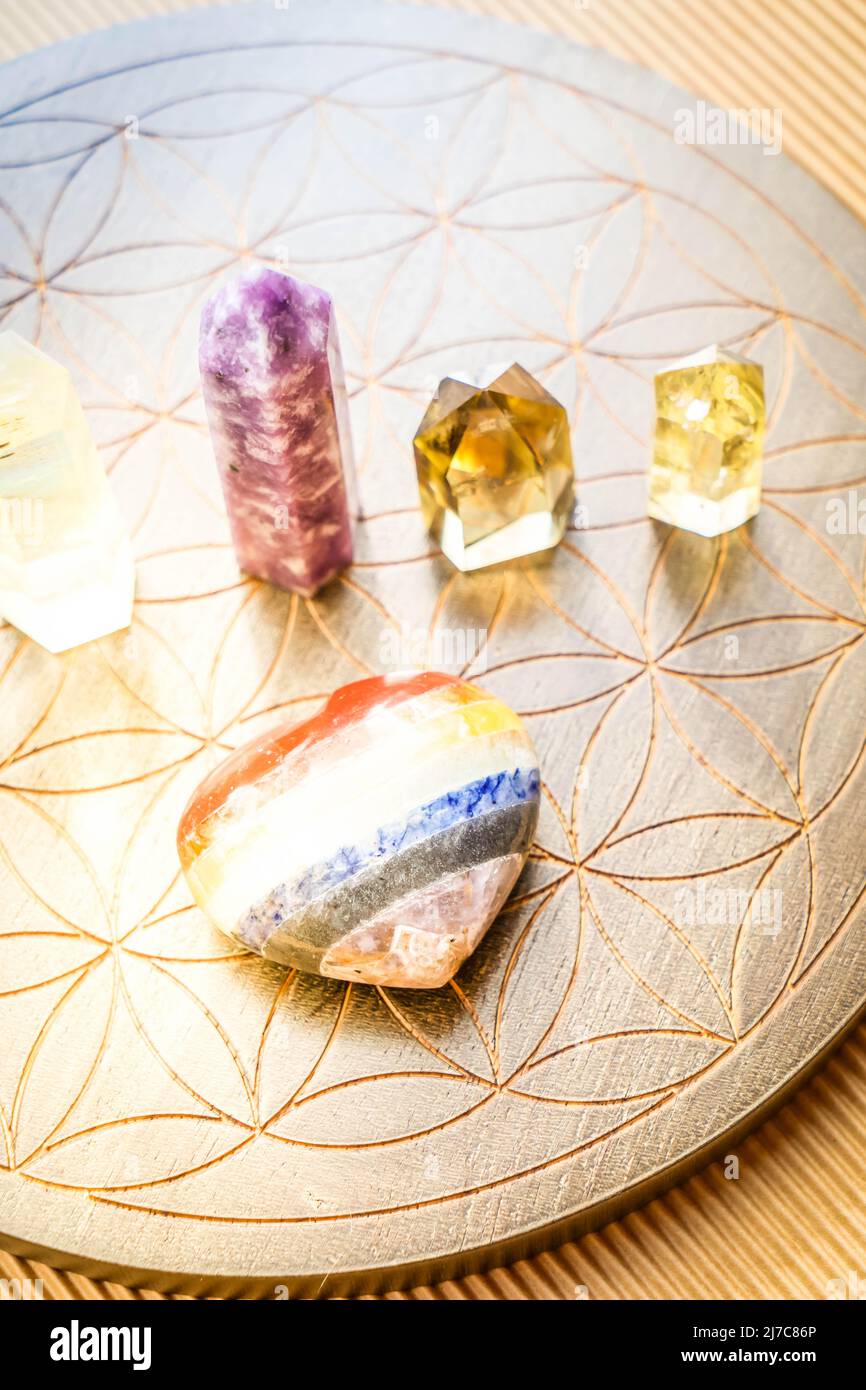 Healing crystals on brown background Stock Photo - Alamy