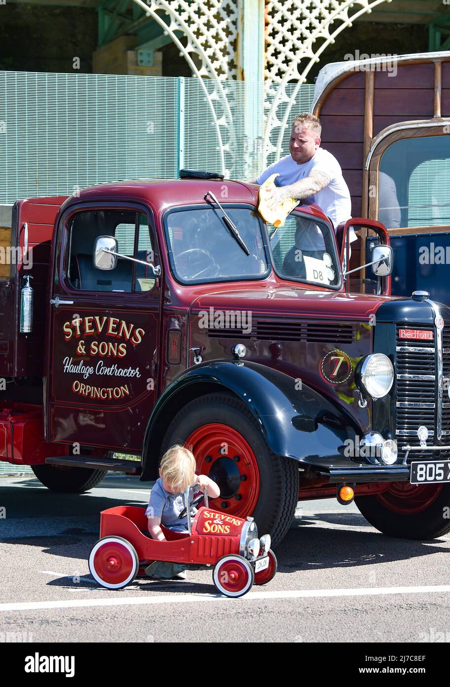 Brighton UK 8th May 2022 - A father and sons polish their Bedford vans at  the 59th Historic Commercial Vehicle Run  on Brighton seafront after arriving from South London . About 200 vehicles which have to be over 20 years old are taking part this year  : Credit Simon Dack / Alamy Live News Stock Photo