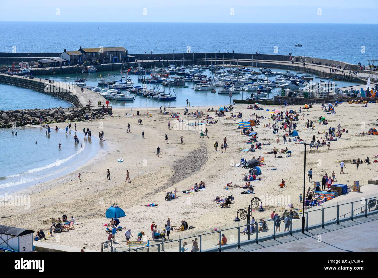 Lyme Regis, Dorset, UK. 8th May 2022. UK Weather Holidaymakers and