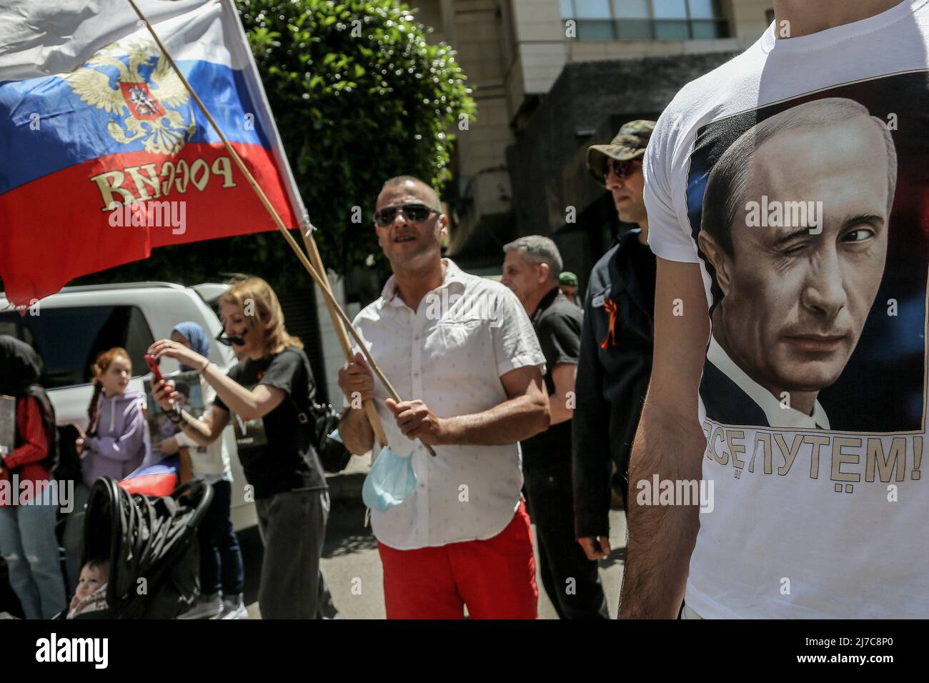 08 May 2022, Lebanon, Beirut: A Russian demonstrator is seen wearing a T-shirt bearing the picture of Russian President Vladimir Putin  during a march held in Beirut to mark Russia's Victory Day, which commemorates the Soviet Union's victory over Nazi Germany in World War Two. Scores of Russian expatriates and Lebanese people took part in the march that also showed support for Russian President Vladimir Putin in his war against Ukraine. Photo: Marwan Naamani/dpa Stock Photo