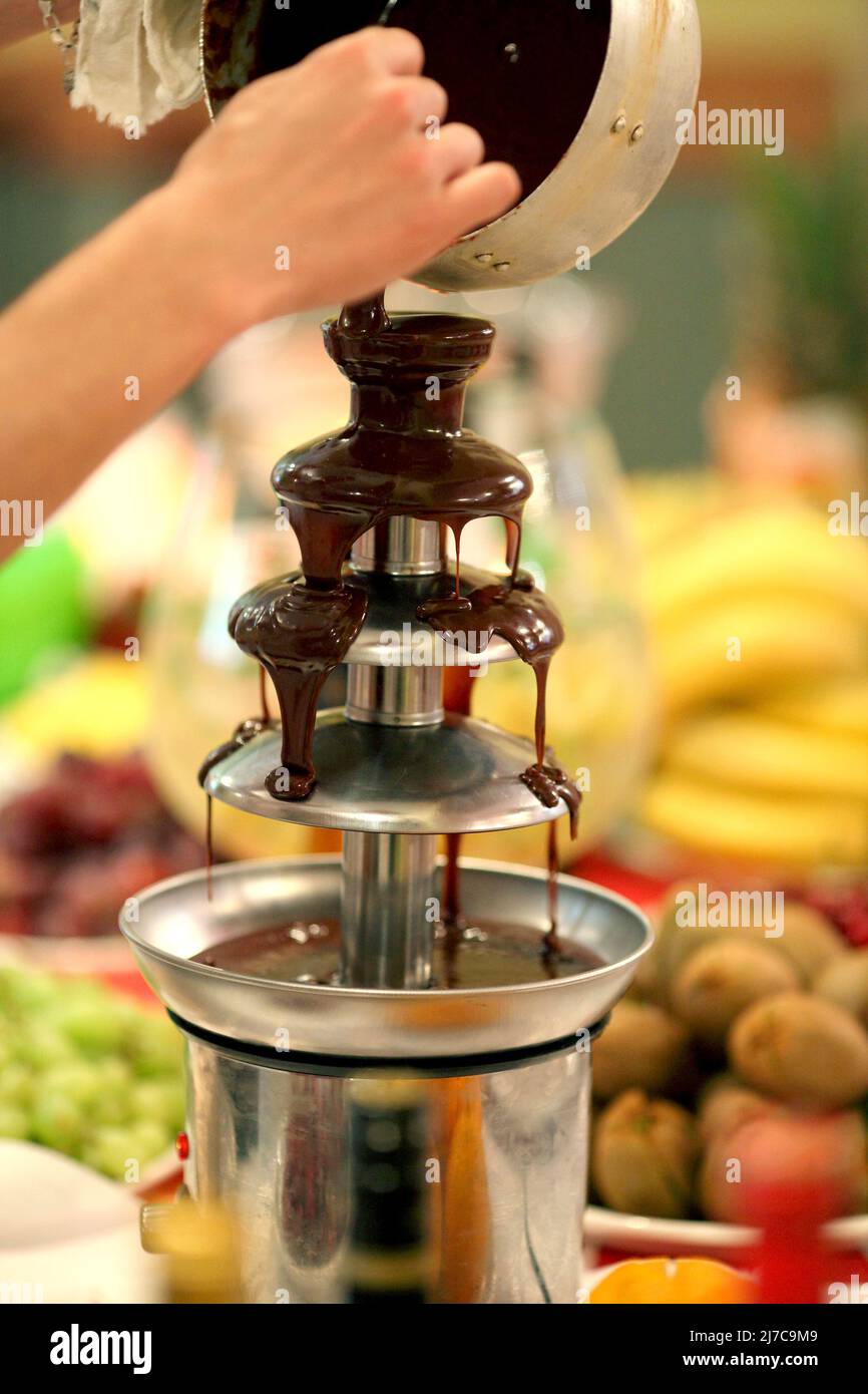 Chocolate fondue fountain Stock Photo Alamy