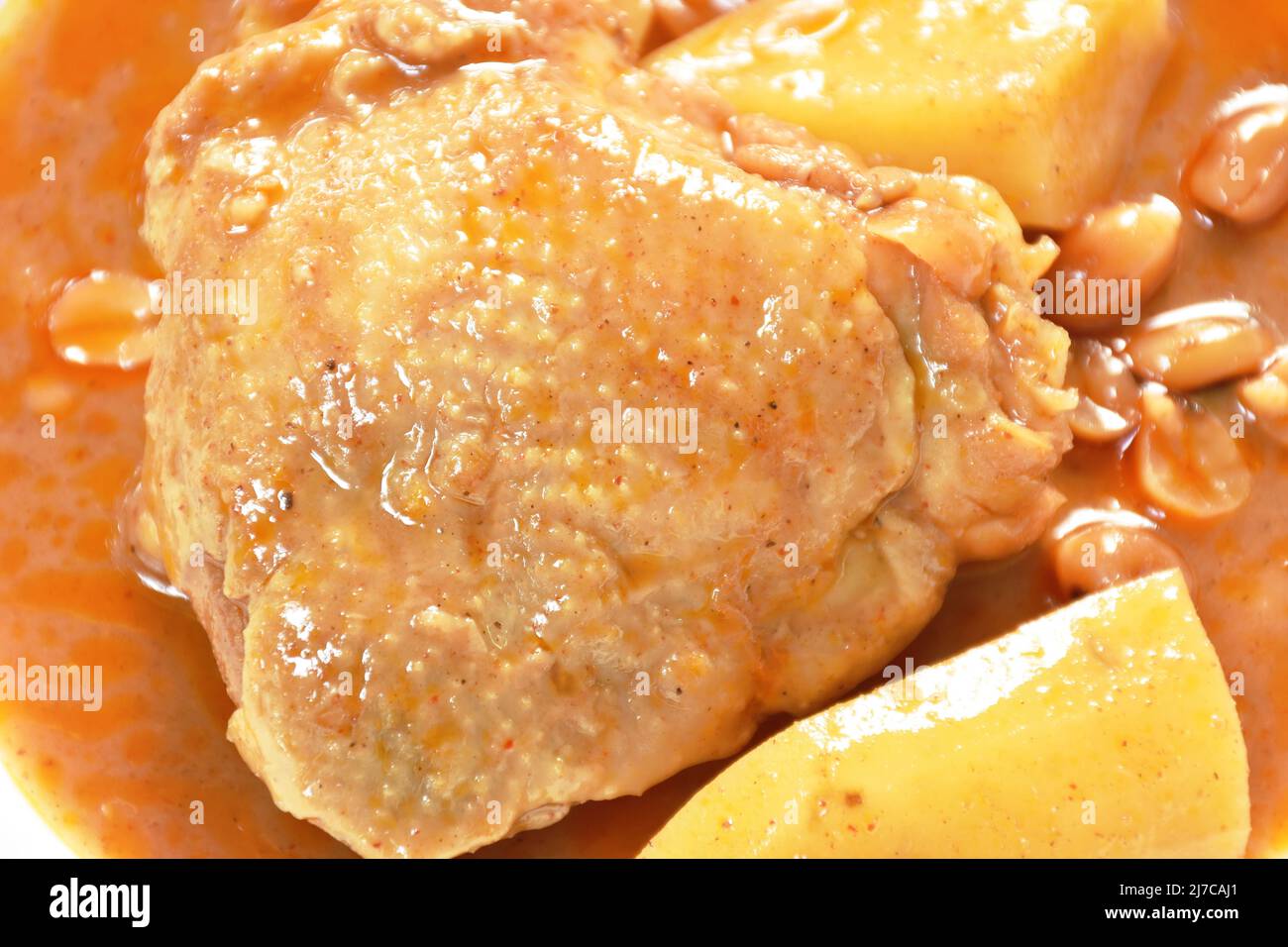 chicken thigh massaman curry with slice potato and peanut on plate Stock Photo
