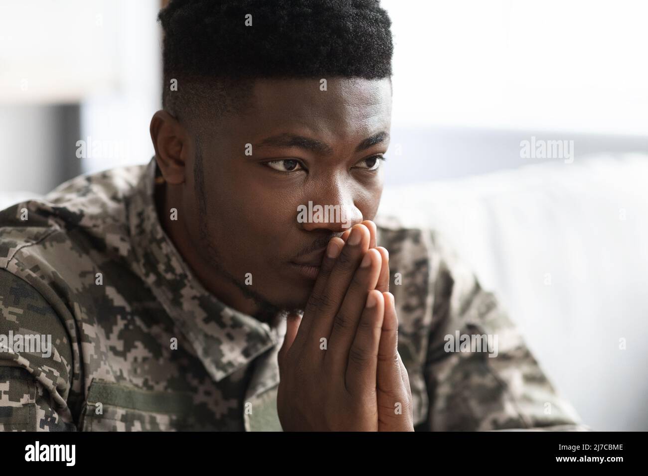Thoughtful military black man staring at copy space Stock Photo - Alamy