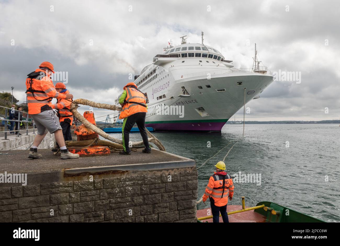 Cobh, Cork, Ireland. 08th May, 2022. Mooring men Eoin Donegan, Danny Grace, Eric Barral with boatman Kevin O'Leary tie up the cruise ship Ambience as she arrives for a visit to Cobh, Co. Cork, Ireland. - Credit; David Creedon / Alamy Live News Stock Photo