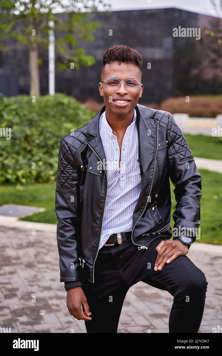 african american male model posing in a park looking at the camera high quality photo 2J7CDK7