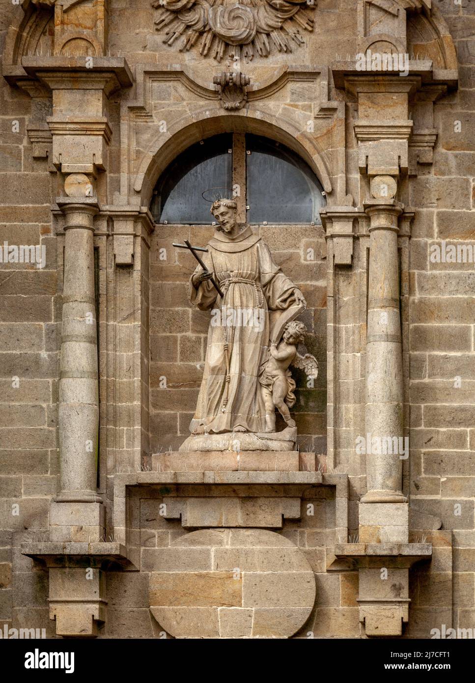 Religious statue on a house in Santiago de Compostela Stock Photo
