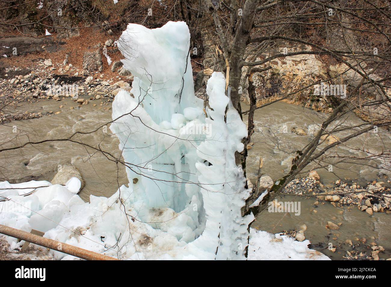 Frozen water column in the forest by the river. Stock Photo